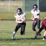Coupevilles Ben Smith runs through a big hole in a game last year. The Wolves will play football in the spring this school year, according to changes made by the WIAA. (Photo by John Fisken)
