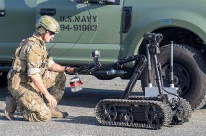 Lt. Nick Woods, attached to Explosive Ordnance Disposal Mobile Unit (EODMU) 5, controls a Mark II Talon remotely operated vehicle (ROV) during a Certification Exercise (CERTEX) on Naval Air Station Whidbey Island, Wash., July 16. Elements of EODMU-1 and EODMU-5 qualified as ready for future operational deployments during the CERTEX, which centered on integrating the two units Sailors with a goal of building a cohesiveness that will help them counter undersea threats and contribute to winning the high-end fight once deployed in support of Navy and geographic combatant command mission priorities. U.S. Navy EOD is the worlds premier combat force for eliminating explosive threats so the Fleet and nation can fight and win wherever, whenever and however it chooses. U.S. Navy photo by Mass Communication Specialist 2nd Class Marc Cuenca/Released