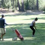 Stephanie Winship aims for the green in a round of golf at Island Greens Monday. The course is set to close Aug. 23. (Photo by Jim Waller/Whidbey News-Times)