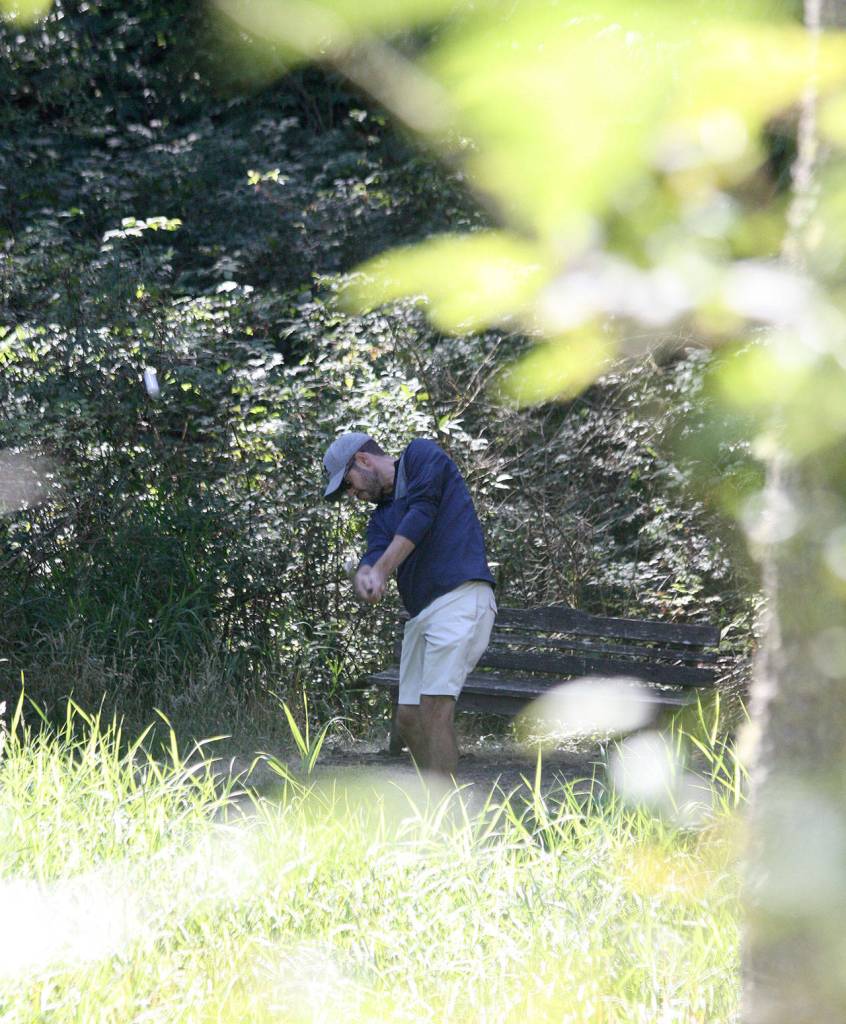 Andrew Winship tees off at Island Greens this week. The South Whidbey course will close next Sunday.(Photo by Jim Waller/Whidbey News-Times)