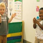 Lincoln Fresch, left, and Quintarius Eaves clap the sillies out during song time at Little Oaks Preschool & Childcare Center. Photo by Kira Erickson/Whidbey News Group.