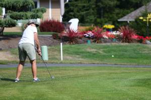 Anna Anderson chips to the green in the Ladies Short and Sweet Par-3 Challenge Thursday, Sept. 10, at the Whidbey Golf Club. (Photo by John Fisken)