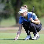 Sara Rhodes, who carded the tournaments best gross score, lines up a putt. (Photo by John Fisken)