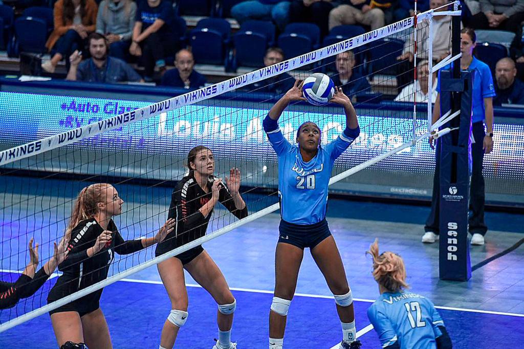 Oak Harbor graduate Janae Payne sets for Western Washington University last volleyball season. (Photo courtesy of WWU Athletics)