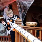 Photo by Kira Erickson/Whidbey News GroupMicky Lacewell gears up to aim some treats down a remote candy delivery system to her granddaughters. Her husband, Kirk Lacewell, recently built the candy chute on the porch of their Langley home as a way to hand out treats from a safe distance on Halloween night.