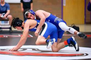 South Whidbeys Drew Aposhyan, top, and the Falcon wrestling team hope to return to play Dec. 28. (Photo by John Fisken)
