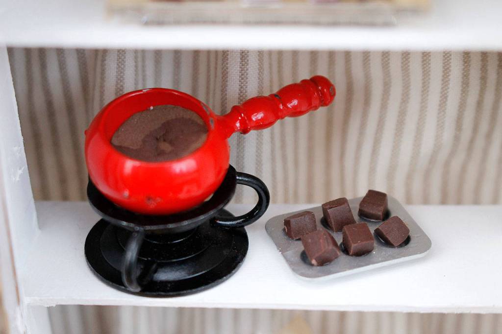 Photo by Kira Erickson/South Whidbey Record
Santosa creates a lot of her tiny foodstuffs out of clay, like this fondue pot.