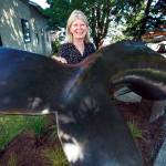 Georgia Gerber with her whale statue on display along First Street in Langley. (Olivia Vanni / The Herald)