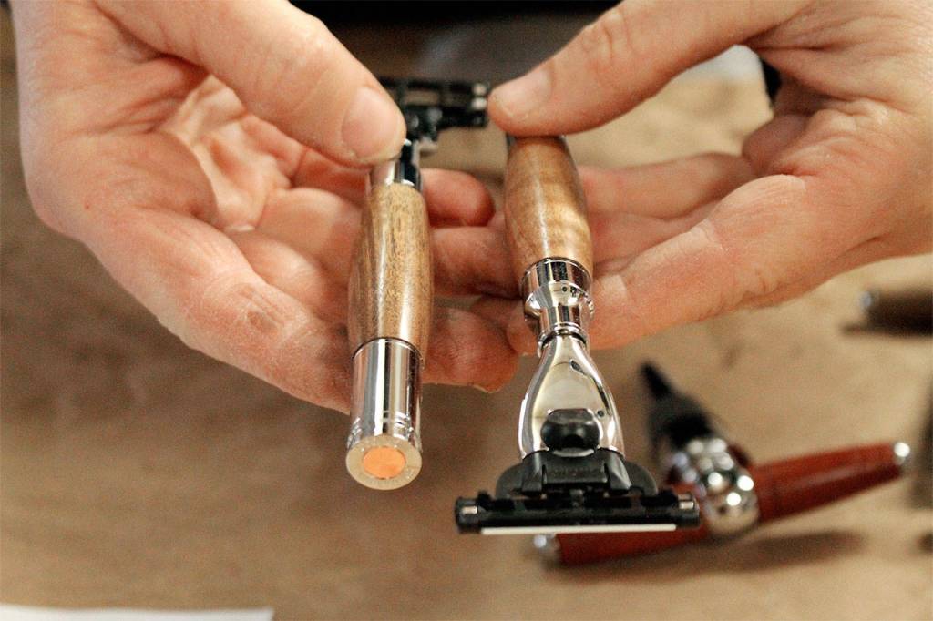 Amber Hawkins shows off two completed razors. Photo by Kira Erickson/South Whidbey Record