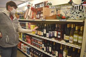 The selection of Whidbey-made wines at 3 Sisters Market in Coupeville offers plenty of gift ideas, according to the sisters mom, Shelly Muzzall. Photos by Emily Gilbert/Whidbey News-Times