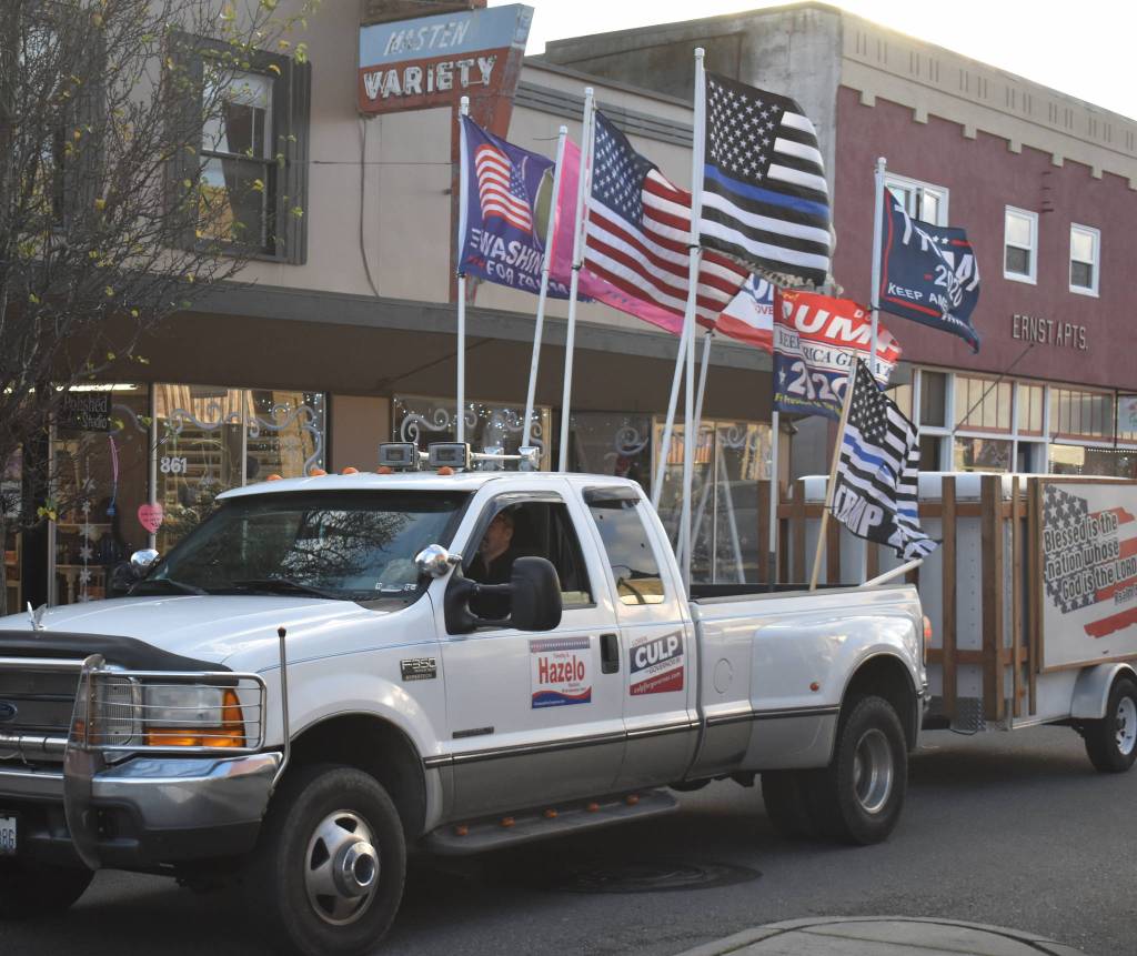 A group of President Trumps supports drove down SE Pioneer Way in Oak Harbor after a rally at the intersection of Highway 20 and SE Pioneer Way Wednesday afternoon. Photo by Emily Gilbert/Whidbey News-Times