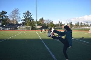 Oak Harbor girls softball team members are allowed to workout together under current COVID-19 restrictions, but are not yet allowed to return to formal practices and competition. School sports may resume this month if Island County and others in the North region can move into Phase 2. Photo by Emily Gilbert/Whidbey News-Times