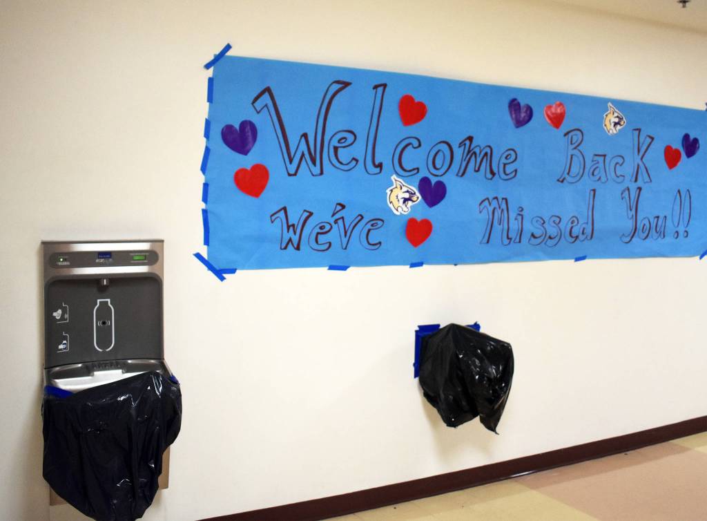 A sign welcoming students back to school is taped above two covered water fountains. Students can fill water bottles, but cant drink from the water fountain itself as a COVID-19 safety precaution. Photo by Emily Gilbert/Whidbey News-Times
