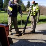 Photo provided by Randi Perry
Tim Grove, left, and Byron Hamilton work on potholing the Langley streets Thursday morning.