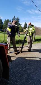 Photo provided by Randi Perry
Tim Grove, left, and Byron Hamilton work on potholing the Langley streets Thursday morning.