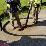 Photo provided by Randi Perry
Tim Grove, left, and Byron Hamilton work on potholing the Langley streets Thursday morning.