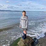 Blake Lewis, 7, at Bush Point where he threw a message in a bottle out to sea. Ruth Smethers later picked it up in Port Townsend. Photo provided by Jessie Lewis