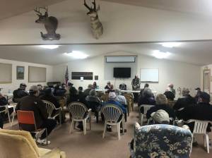 Judy Thorpe, left, Tracy Weissel, Sarah Westcott and Michael Thorpe listen to the audience during a community meeting at the Central Whidbey Sportsmens Association in Coupeville last Friday. About 40 people came to the meeting to discuss their concerns about the Whidbey Homeless Coalitions proposed emergency overnight shelter on Morris Road near Coupeville. Photo by Emily Gilbert/Whidbey News-Times