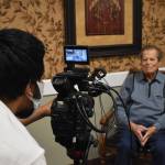 Rishi Sharma checks levels in his camera before interviewing WWII combat veteran Frank Burns of Freeland last Saturday. Sharma travels the country interviewing WWII combat veterans for his oral history project and nonprofit, Heroes of the Second World War. Photo by Emily Gilbert/Whidbey News-Times