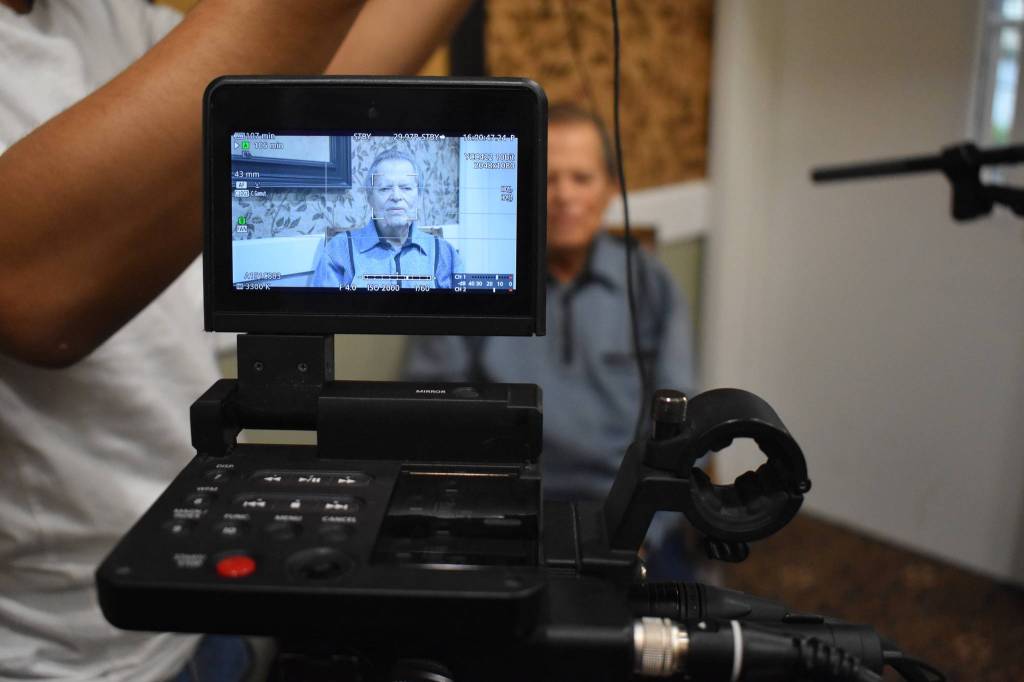 Rishi Sharma intreviewed WWII combat veteran Frank Burns of Freeland last Saturday. Sharma travels the country interviewing WWII combat veterans for his oral history project and nonprofit, Heros of the Second World War. Photo by Emily Gilbert/Whidbey News-Times