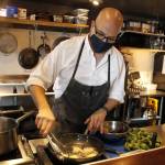 Stefen Bosworth, co-owner and chef of Savory, cooks up some squid ink linguine. (Photo by Kira Erickson/South Whidbey Record)