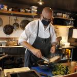 Stefen Bosworth, co-owner and chef of Savory, cooks up some squid ink linguine. (Photo by Kira Erickson/South Whidbey Record)
