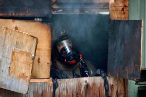 Ed Klaszky, a firefighter with Clark County Fire Dept. in Nevada, during a controlled burn training exercise organized by the Oak Harbor Fire Department on Saturday, May 22. Photo by Bryan Fick/WestCoast Fire Media