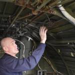 Pacific Northwest Naval Air Museum President Wil Shellenberger shows the inside of the PBY-5A Catalina aircraft. He said the museum is looking for volunteer docents to give tours of the plane this summer. Photo by Emily Gilbert/Whidbey News-Times