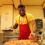 Jamel Hale prepares chicken at his restaurant, Hales Kitchen, May 20. (Photo by Karina Andrew/Whidbey News-Times)
