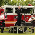 AR Johnathan Ferrell, center, plays Amazing Grace, accompanied by Don Scobie and Shannon Mowatt.