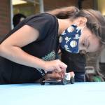 Photo by Emily Gilbert/Whidbey News Group
South Whidbey Elementary student Aura Smith, who is in fourth grade, examines her solar car.