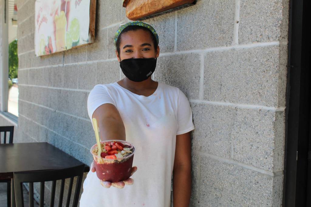 Taylor Moore shows off one of her signature smoothie bowls. (Photo by Karina Andrew/Whidbey News-Times)