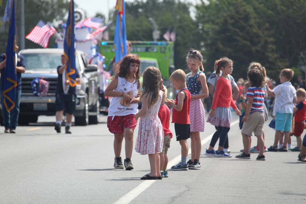 Kids line up, eager to stuff their pockets with candy. (Photo by Karina Andrew/Whidbey News-Times)