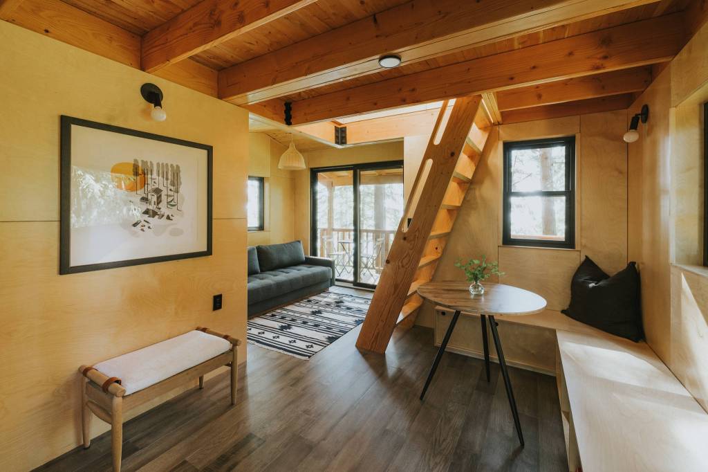 Guests will feel at home in the cozy but modern treehouse, which does have indoor plumbing. (Photo by Bryton Wilson)