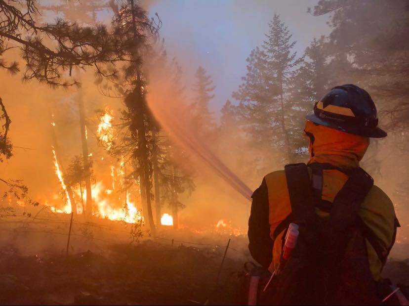 A firefighter battles the Lick Creek fire. (Photo provided by Central Whidbey Island Fire and Rescue)