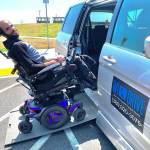 Photo by Heather Mayhugh
Stuart Peeples demonstrates how to enter Heather Mayhugh's wheelchair van. In recent months, while navigating the new Mukilteo ferry terminal, Mayhugh has struggled to unload her clients who need access to the restroom.