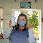 Photo provided
Keasha Campbell, owner of Crabby Coffee in Freeland, models a mask made by Betty Lade.