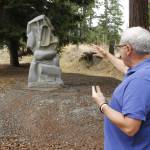 Burt Beusch, executive director of the Cloudstone Foundation, points out one of many sculptures in the Cloudstone Sculpture Park. (Photo by Kira Erickson/South Whidbey Record)