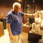 Burt Beusch, executive director of the Cloudstone Foundation, points out one of many sculptures in the Cloudstone Sculpture Park. (Photo by Kira Erickson/South Whidbey Record)
