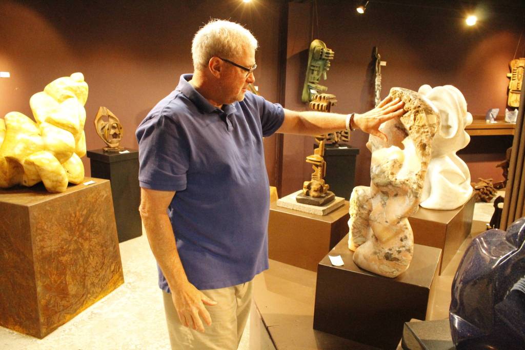 Burt Beusch, executive director of the Cloudstone Foundation, points out one of many sculptures in the Cloudstone Sculpture Park. (Photo by Kira Erickson/South Whidbey Record)