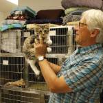 Veterinarian David Parent holds Tommy the cat. Although he is known for treating wild birds, Parent has tended to just as many domestic animals. (Photo by Kira Erickson/South Whidbey Record)