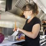 Photos by Kira Erickson/South Whidbey Record
Employee Kim McLain grates carrots for a salad. Below, a serving of chicken teriyaki from IC Teriyaki.