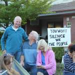 Photos by Karina Andrew/Whidbey News-Times
Wayne Flaaten, standing, gathers with other community members to listen to a South Whidbey School District board meeting.