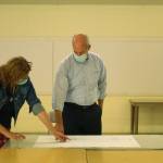 Marian Myszkowski and Rep. Rick Larsen review the plans for the Goosefoot Community Kitchen. (Photo by Karina Andrew/Whidbey News-Times)