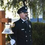 Navy photo by Mass Communications Specialist Second Class (MC2) Aranza Valdez
Eric Dolan, a driver/operator with Navy Region Northwest Fire and Emergency Services, rings a bell Friday, Sept. 10, during NAS Whidbey Islands ceremony to remember the 9/11 terrorist attacks 20 years ago.