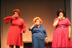 From left, Sarah Gallella, Jill Jackson and Erin Tombaugh take a sip of tea during their bows. (Photo by Karina Andrew/Whidbey News-Times)