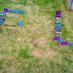 Signs supporting incumbent candidates for the South Whidbey school board were stolen and arranged in a vulgar message on school grounds Sunday.