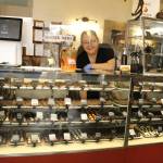 Photo by Kira Erickson/South Whidbey Record
Mona Newbauer arranges a display of chocolates in her store.