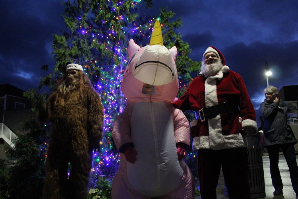 Photo by Karina Andrew/Whidbey News-Times
Santa lights the tree in downtown Oak Harbor, aided by none other than Sasquatch and a pink unicorn.