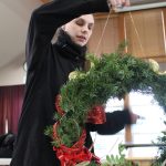 Pacific Rim Institute intern Dawn Meredith puts together a holiday wreath made of native plants.